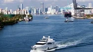 Yacht Leaving Miami Shipyard By Aerial Drone Stock Footage