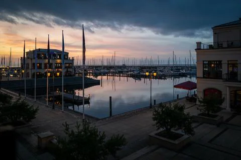 Yacht Marina at Sunset Under Dramatic Storm Clouds Stock Photos