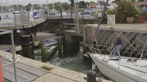 Yacht moving through lock Stock Footage 41236161