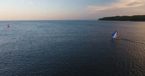 Yacht Opens Sails On The Way To Open Ocean. Aerial View Stock Footage 92948412