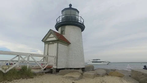YACHT PASSING LIGHTHOUSE Stock Footage 104841778