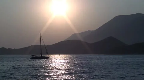Yacht passing by under sundown Stock Footage 27747281