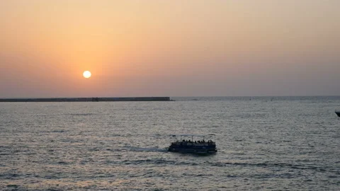 Yacht in the rays of the setting sun Stock Footage 94860893