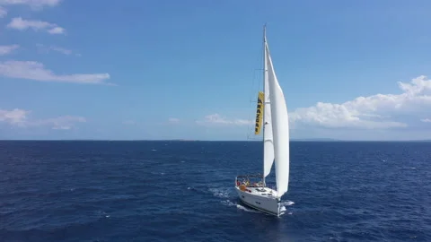 Yacht sailing at sunset during a storm. Luxury vacation at sea 動画素材 134456589
