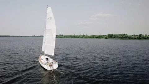 The yacht sails on the Dnipro river. Drone flies around the sailing yacht Stock Footage 171717853