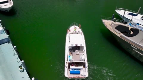 Yacht sails into the harbor - Drone close up shot Miami Beach Marina 4k Stock Footage 244007500