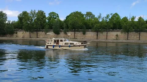 The yacht sails on the river Seine in Paris Stock Footage 154792607
