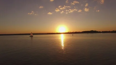 Yacht sails at a sunset Stock Footage 94431205