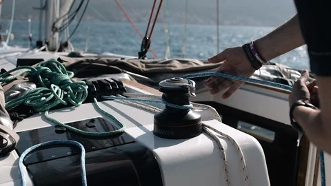 Yacht winch operation A man controls the sails Video stock 107970964
