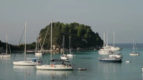 Yachts anchored in idyllic lakka bay, paxos, greece Stock Footage