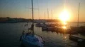 Yachts and boats docked near pier, amazing sunset and nature, golden hour HD Footage