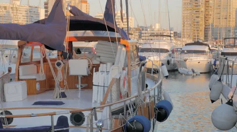 Yachts docked in harbor at sunset 4K UHD Stock Footage 61483032