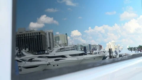 Yachts docked in Miami reflected on the window of a boat. Stock Footage 82001723