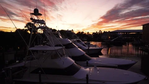 Yachts in a harbor during sunset Stock Footage 124325190