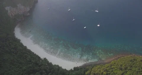 Yachts Moored In Cove At Monkey Beach, Phi Phi Islands, Thailand, Overhead Drone Stock Footage 79245876