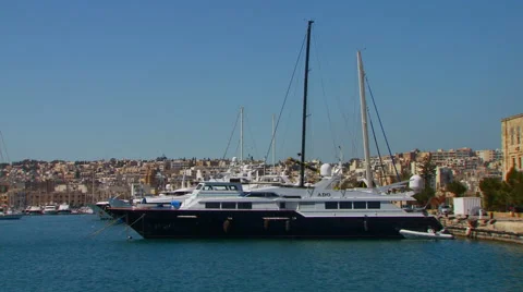 Yachts moored on harbor Stock Footage 57815331