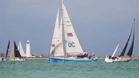 Yachts Passing Hurst Castle Lighthouse 2025 Round the Island Race Isle of Wight Stock Footage 337936059