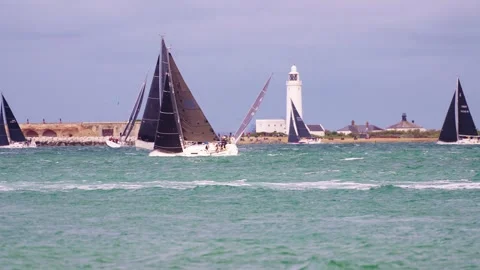 Yachts Passing Hurst lighthouse 2025 Round the Island Race Isle of Wight Stock Footage 337935920