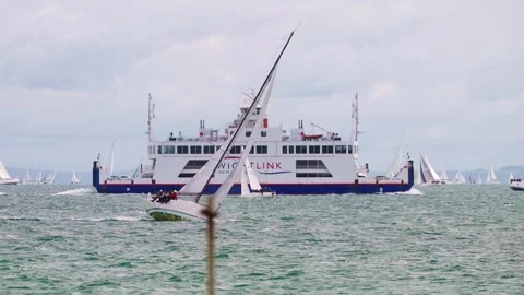Yachts Passing Wightlink ferry during 2025 Round the Island Race Isle of Wight Stock Footage 337936846