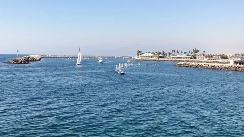 Yachts sail from the shore Stock Footage 125893032