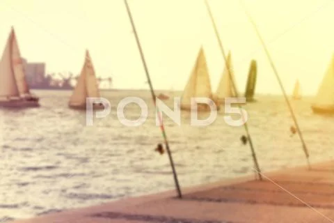 Yachts a sailing regatta at the sea during sunset . Blurred image of a yachts Stock Photos
