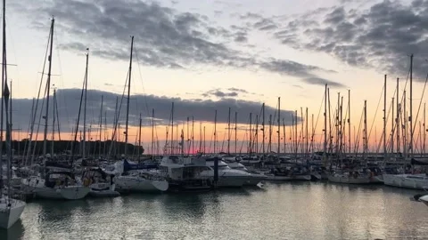 Yachts on a sunset - pan Stock Footage 160699450