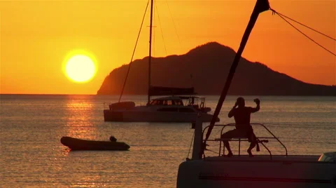 A yachtsman taking a selfie at sunset on his yacht Video stock 48635166
