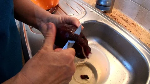 Yacon root peeling in kitchen, handmade, authentic works, homemade, 4K Video stock 97952850