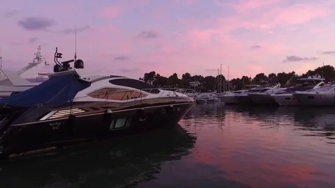 Yahts at  the Marina de Cala D'or. Pink sky Stock Footage 71357165