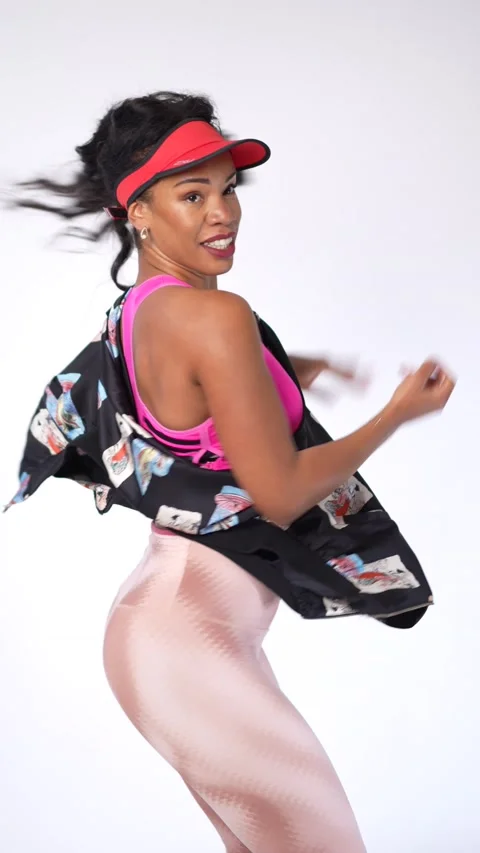 YAIMA 4k VERT 16Zumba class, black ethnic woman in a workout on a white bac.. Stock Footage 231479125