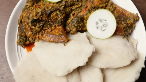 Yake Yake, Grated Cassava With Amatadzi, Spicy Green Leaf Stew, Agushi and Tuna Video stock 346249953