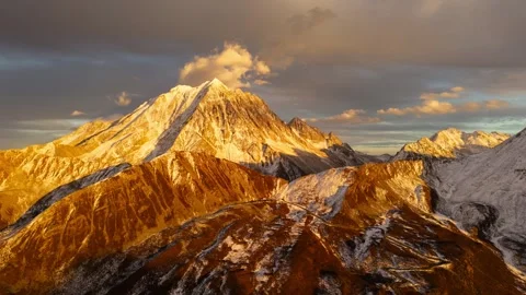 Yala Snow Mountain Sunset Hyperlapse Golden Hour Aerial View of Snow Peaks in 動画素材 320353149