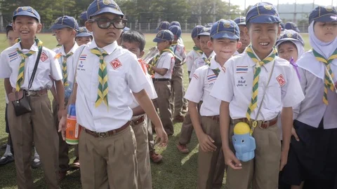 YALA, THAILAND Thai Boy Scout Day young boys and girls in uniform on parade Stock Footage 123179953