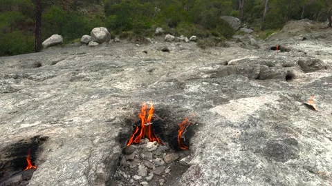 Yanartas methane flames burn through rocky vent - Burning Ground and Gas Source Stock Footage 339792072