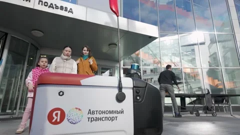 Yandex Autonomous Transport Robot Outside an Office Entrance Stock Footage 339243380