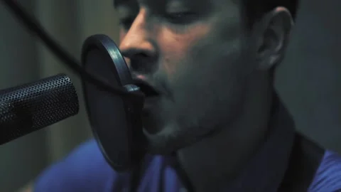 Yang man vocalist expressive Singing Into Microphone Stock Footage 93775615