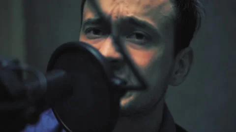 Yang man vocalist expressive Singing Into Microphone Stock Footage 93775622