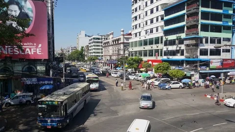 Yangon central road from above, traffic, pedestrians, Nescafe ad, buildings Видео 77801971