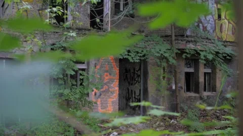 Yard of an abandoned building with broken windows 스톡 동영상 58497026