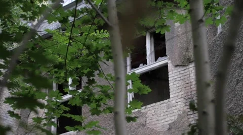 Yard of an abandoned building with broken windows Stock-Footage 58497436