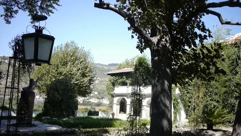 A yard with garden and hanging lantern. Stockbeeldmateriaal 80248595