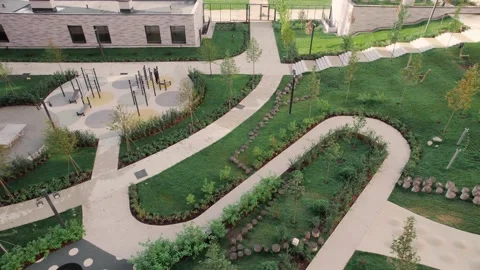 Yard - garden and multi-storey apartment buildings recently commissioned Stock Footage 223140055