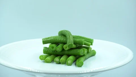 Yardlong beans in white background. Green boiled vegetables on a white plate. Stock Footage 124029024