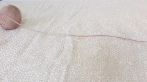 Yarn ball unwinding Stock Footage 64942562