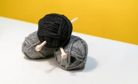 Yarn ball of wool thread for knitting with wooden spindle or needle Stock Photos