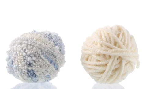 Yarn for handwork and knitting. Set on a white background with reflection. Stock Photos