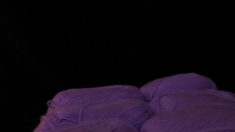 Yarn for knitting. A ball of thread on a black background 動画素材 247278772