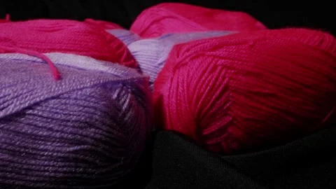 Yarn for knitting. A ball of thread on a black background 動画素材 247278922