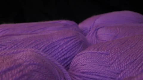 Yarn for knitting. A ball of thread on a black background 動画素材 248061606