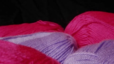 Yarn for knitting. A ball of thread on a black background 動画素材 251647635